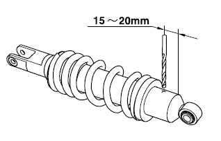 Disposing of a rear shock absorber